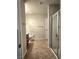Featuring a tiled floor and glass shower, the bright bathroom offers a clean and modern design at 4675 Basilicata Ln # 103, North Las Vegas, NV 89084