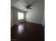 Cozy bedroom featuring hardwood floors and a window providing natural light at 4675 Basilicata Ln # 103, North Las Vegas, NV 89084