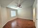 The bedroom features beautiful wood flooring and a ceiling fan, creating a comfortable and stylish space at 4675 Basilicata Ln # 103, North Las Vegas, NV 89084