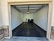 Spacious one-car garage with a clean floor and good lighting for parking and storage at 4675 Basilicata Ln # 103, North Las Vegas, NV 89084