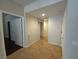 Inviting hallway with tile flooring, leading to various rooms at 4675 Basilicata Ln # 103, North Las Vegas, NV 89084