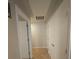 Hallway with tile flooring, doors and access to other rooms at 4675 Basilicata Ln # 103, North Las Vegas, NV 89084