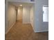 Tiled hallway with natural light and a front door view at 4675 Basilicata Ln # 103, North Las Vegas, NV 89084
