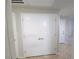 A hall area showcases a large linen closet featuring double doors, adding practicality and extra storage at 4675 Basilicata Ln # 103, North Las Vegas, NV 89084