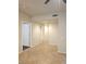 Hallway featuring tile floor and open doorways at 4675 Basilicata Ln # 103, North Las Vegas, NV 89084