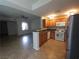 Open kitchen with oak cabinets and stainless steel appliances at 4675 Basilicata Ln # 103, North Las Vegas, NV 89084