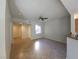 Bright, open living room featuring a ceiling fan and neutral tile flooring at 4675 Basilicata Ln # 103, North Las Vegas, NV 89084