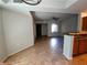 Bright living room with tile floors, an open kitchen, and recessed lighting at 4675 Basilicata Ln # 103, North Las Vegas, NV 89084
