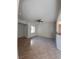 Spacious living room with a ceiling fan, window, and easy kitchen access at 4675 Basilicata Ln # 103, North Las Vegas, NV 89084