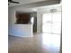 Open-concept living space with updated flooring and access to outdoor balcony at 4675 Basilicata Ln # 103, North Las Vegas, NV 89084
