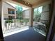 A covered patio overlooks lush landscaping and other community buildings at 4675 Basilicata Ln # 103, North Las Vegas, NV 89084