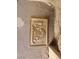 Close-up of a decorative wall plaque on the exterior at 4675 Basilicata Ln # 103, North Las Vegas, NV 89084
