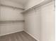 Walk-in closet with carpet and shelving for organized storage solutions at 4705 Delicate Arch Ct, North Las Vegas, NV 89031