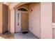 Inviting home entrance with a secured metal door and arched entryway detail at 4705 Delicate Arch Ct, North Las Vegas, NV 89031