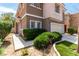 Beautifully maintained two-story home includes a two-car garage and lush green shrubbery at 4705 Delicate Arch Ct, North Las Vegas, NV 89031