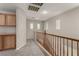 Upstairs hallway with carpet and custom cabinetry at 4705 Delicate Arch Ct, North Las Vegas, NV 89031