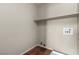 Practical laundry room features tile flooring and convenient shelving for added storage at 4705 Delicate Arch Ct, North Las Vegas, NV 89031