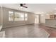 The living room boasts tile floors, multiple windows, and a view into the kitchen and backyard at 4705 Delicate Arch Ct, North Las Vegas, NV 89031