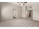 Carpeted main bedroom with ceiling fan and closet access at 4705 Delicate Arch Ct, North Las Vegas, NV 89031