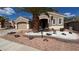 Charming single-story home featuring a low-maintenance desert landscape and a two-car garage at 494 Dart Brook Pl, Henderson, NV 89012