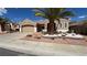 Charming single-story home featuring a low-maintenance desert landscape and a two-car garage at 494 Dart Brook Pl, Henderson, NV 89012