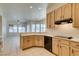 Modern kitchen featuring neutral cabinets, and a view into the living room at 494 Dart Brook Pl, Henderson, NV 89012