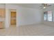 Bright living room with tile flooring, ceiling fan, and a view of the neighborhood at 494 Dart Brook Pl, Henderson, NV 89012