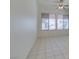 Bright living room featuring tile flooring and large windows for ample natural light at 494 Dart Brook Pl, Henderson, NV 89012