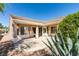 Exterior view of covered patio surrounded by desert landscaping at 494 Dart Brook Pl, Henderson, NV 89012