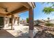 Large covered patio featuring decorative pillars and a ceiling fan at 494 Dart Brook Pl, Henderson, NV 89012