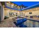 Luxury backyard with pool, spa, covered patio, and outdoor kitchen at 5 Crystal Tree Pass, Henderson, NV 89052