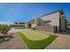 Spacious backyard with a putting green, perfect for outdoor activities at 5 Crystal Tree Pass, Henderson, NV 89052