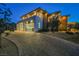 Modern two-story home with a three-car garage and landscaped front yard at 5 Crystal Tree Pass, Henderson, NV 89052
