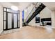 Grand foyer featuring a modern staircase, soaring ceilings, and a dining area with modern light fixture at 5 Crystal Tree Pass, Henderson, NV 89052
