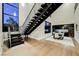 Elegant foyer with an open staircase, hardwood floors, and a dining area that offers inviting spaces at 5 Crystal Tree Pass, Henderson, NV 89052