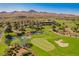 Beautiful golf course view with water features, sand traps, and clubhouse in a scenic mountain setting at 5 Crystal Tree Pass, Henderson, NV 89052