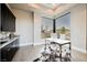Bright home office with a large window, sleek desk, and custom built-in storage at 5 Crystal Tree Pass, Henderson, NV 89052