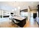 Open-concept kitchen with large island, stainless steel appliances, and modern finishes throughout at 5 Crystal Tree Pass, Henderson, NV 89052