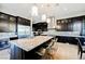 Elegant kitchen featuring a large island, custom cabinets, and stainless steel appliances at 5 Crystal Tree Pass, Henderson, NV 89052