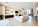 Bright, modern living room with fireplace, media center, and open access to staircase at 5 Crystal Tree Pass, Henderson, NV 89052