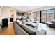 Bright living room boasts a comfortable sofa, stylish wet bar, and sliding glass doors to the patio at 5 Crystal Tree Pass, Henderson, NV 89052