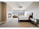 Spacious main bedroom with fireplace, private balcony access, and neutral decor at 5 Crystal Tree Pass, Henderson, NV 89052