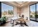 Home office boasting a large window, stylish desk, and serene views of the surrounding landscape at 5 Crystal Tree Pass, Henderson, NV 89052