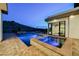 Stunning backyard pool and spa with a modern design and adjacent fitness room at 5 Crystal Tree Pass, Henderson, NV 89052