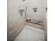 Modern shower with white tile, built-in marble seat, and sleek linear drain at 5 Crystal Tree Pass, Henderson, NV 89052