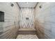 Contemporary shower with dual shower heads, built-in bench, and stylish tile work at 5 Crystal Tree Pass, Henderson, NV 89052