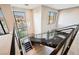 Modern staircase with steel railings and an open design, enhanced by large windows at 5 Crystal Tree Pass, Henderson, NV 89052