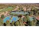 Aerial view of well-maintained tennis courts near a lush golf course and upscale residential community at 5 Crystal Tree Pass, Henderson, NV 89052
