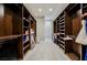 Spacious walk-in closet featuring custom wood shelving and ample storage space at 5 Crystal Tree Pass, Henderson, NV 89052