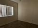 Simple bedroom with natural light, wood-look floors and neutral wall color at 5170 S Jones Blvd # 108, Las Vegas, NV 89118